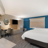 Très grand lit plateforme rembourré de style DoubleTree
